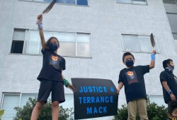 Nevaeh and Weston Mack stand outside the apartment building where a body was found on May 4, 2021. Family and friends identified the body as Terrance Mack, the children's father. More than four years later, no charges have been laid for the murder. (Submitted photo)