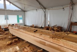 Initial shaping and carving of canoe at Nucci. (Progress photo provided by Moses Towell, Resource and Development Manager)