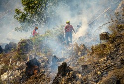 By Aug. 14 rain started to fall on the blaze, continuing through the next day and slowing it down. This enabled personnel to better access the wildfire. (BC Wildfire Service photo)