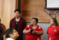 Flanked by justice manager Curtis Joseph and Hannah Frank, haw̓iiḥtaqumł (House of Wickaninnish) reads the list of Tla-o-qui-aht members who have gone missing or been murdered.