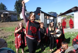 Students from Haahuupayak performed for the crowd outside the Tseshaht Longhouse. (Denise Titian photo)