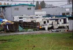 Low-income and homeless individuals continue to occupy trailers on a lot next to the Wintergreen Apartments on Fourth Avenue. (Karly Blats photo)