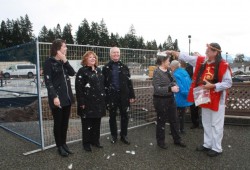 Ron Hamilton performs a cleansing with eagle down at the site of the project's groundbreaking.