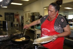 April White fries bread at the women's gathering in Nanoose Bay.