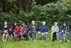 Members of the elders working group pose for a portrait at the Combers Beach trailhead in the Pacific Rim National Park Reserve during an event welcoming visitors to use new multi-use pathway that connects Tofino and Ucluelet, on June 28, 2022.