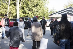 Tla-o-qui-aht First Nation members gathered in front of the nation's main office near the Best Western Plus Tin Wis Resort in Tofino to protest recent housing evictions to council members, on March 31, 2022.