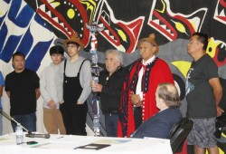 Ahousaht Ha’wiih carry out protocols at the start of the Specific Claims Tribunal held in Ahousaht Apr. 30 to May 3. Elder David Frank explained to the Judge who the Ha’wiih (chiefs) are and what is rightfully theirs. From left to right: Chief John Keitlah Jr., the two grandsons of Maquinna, Harold Little Sr., speaker for Maquinna, Tyee Ha’wilth Maquinna (Lewis George) and Judge William Grist. (Denise Titian photo)