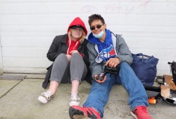 Matthew C. sits with a friend outside the Port Alberni Safe Injection Site on 3rd Avenue. (Denise Titian photo)