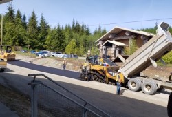 A road in Anacla's Upper Village is paved this spring to serve the communty's future subdivision. (Heather Thomson photo)