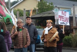 Roy Martin, Desmond Tom and Joe Martin march through Tofino.