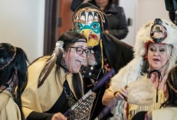 Singers perform at the provincial government's announcement on 