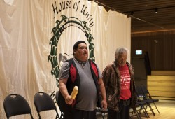 Brian Lucas (left), Quu'asa wellness worker, says an opening prayer to start the day, on Feb. 14, 2022, at the House of Unity, in Tsaxana, on the traditional territory of the Mowachaht/Muchalaht First Nation.