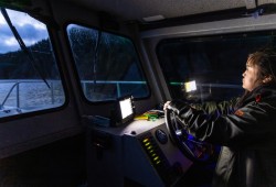 Judae Smith, a Nuchatlaht guardian and fisheries technician drives a boat in her nation's territory to assess the effects of a diesel spill. (Nuchatlaht First Nation photo)