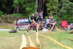 Cecil Joseph stretches strips of cedar during Ditidaht Days.