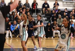 Ravens player Chenoa McCarthy-Tom is ready for the pass during the championship final.