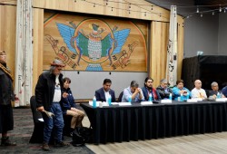 Tla-o-qui-aht Elder Levi Martin performs an opening prayer for a signing ceremony on June 27 at Tin Wis Resort. 