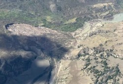 An estimated 30,000 cubic meters of wooden material was sent down the Chilcotin and Fraser River, after water broke through the buildup of earth and debris from the landslide, which occurred July 30. Pictured is the site before the water broke through. (Facebook photo)