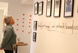 Hallway Gallery: Karen Charleson looks over the Honouring Our Survivors exhibit. 
