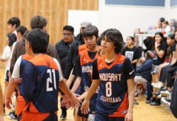 Ahousaht players shake hands with Snaw Naw As after a U-13 boys game.