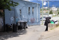 Cory Touchie sifts through his belongings outside the Port Pub. 