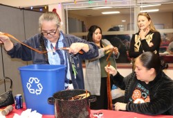 Dr. Charlotte Cote of the Tseshaht Firt Nation, who is a professor at University of Washington, teaches cedar weaving in Seattle. (Denise Titian photo)