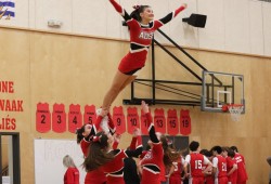 The ADSS cheer team displayed their acrobatics for the crowd during breaks in the play on Jun. 13.