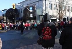 Patrick Leon of the W̱SÁNEĆ Wolf Pack stands in the centre of a circle during the Stolen Sisters Memorial March in downtown Victoria on Feb. 14.