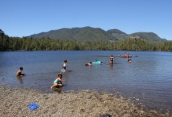 Children swim at Jewitt Lake, when the Whalers' Washing House once was on an unnamed island. (Eric Plummer photo) 