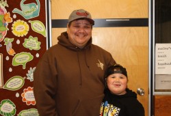 “If you’re really here to help us and speak for us, then you should be able to listen,” says Kevin Jules after his recent meeting with Aaron Gunn. Jules is pictured with his son Noah at the Kyuquot Elementary Secondary School. (Eric Plummer photo)