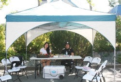 Alanis George and Vicky Charles attend a table provided by the Kuu-us Crisis Line Society to provide any support to those in attendance. (Chloe Wangler photo)