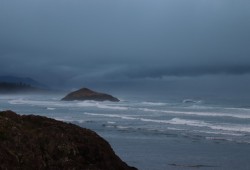 A moody sky over Lovekin Rock on Long Beach.