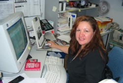 Denise Titian began working at Ha-Shilth-Sa on Jan. 15, 1996, under former editor Bob Soderlund. Over her career she witnessed the introduction of digital technology, computer layout and electronic communication tools into the newspaper business. Pictured is Denise Titian at her office in 2000. (Ha-Shilth-Sa archive photo)