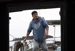 Terry Crosina works as a deckhand aboard Elmer Frank's troller fishing boat, on July 22, 2020. (Melissa Renwick photo)