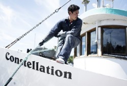 James Martin repositions his brother's boat so that he can paint its sides more easily, in Ucluelet, on July 15, 2020. The boat is part of the rights-bases T’aaq-wiihak fleet. (Melissa Renwick photo)