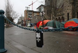 A Naloxone kit hangs by an encampment on Pandora Avenue in Victoria in late January 2024. With the prevalence of illicit drug use among the unhoused in encampments, harm reduction personnel were seen checking up on people at the Pandora Avenue location. (Eric Plummer photo)