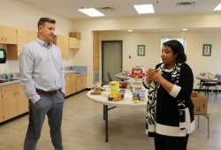 Principal Nick Seredick and Nourish Cowichan’s Fatima Da Silva discuss food logistics in the Eighth Avenue Learning Centre kitchen. 