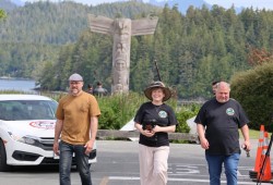 Tofino Mayor Dan Law walks with Mid Island-Pacific Rim MLA Josie Osborne and MP Gord Johns.