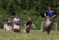 Potato sack races take place in the field behind Kyuquot Elementary Secondary School on July 6.