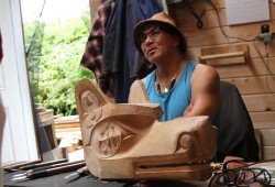 Sanford Williams saw a steday stream of visitors to his carving shed, where he is working on several pieces.