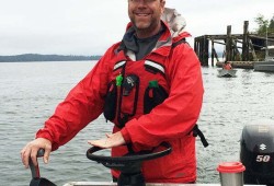 Sean Rodgers navigates a vessel during Ocean Networks Canada operations off the coast of Vancouver Island.
