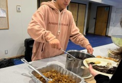 Andrew Clappis Jr. serves up a sweet and salty seal dish based on based off a Vietnamese caramelized pork recipe. (Rachel Dickens-Greening photo) 