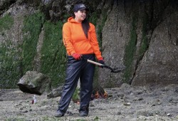 Sheena Charleson digs space for a clam garden in the intertidal area.