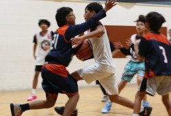 A player with Snaw Naw As dribbles through Ahousaht defenders who were playing on a team coached by Michael Swan. The under-13 game was part of an action-packed jamboree with more than its fair share of aggressive play.