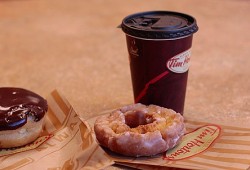At Tim Hortons a medium double double contains 200 calories with 13g of fat and 21g of sugar (five teaspoons). (Wikimedia Commons photos)