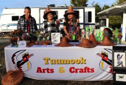 Mother Annie George makes paintings while Elizabeth George weaves cedar accessories with help from her husband Matthew Curly.