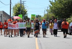 Carol Frank, centre, leads a walk in memory of her niece, Lisa Marie Young, in Nanaimo on June 26, 2021. Annual walks in Lisa Marie's honour have been held since 2003, one year after the young woman went missing. (Eric Plummer photo) 