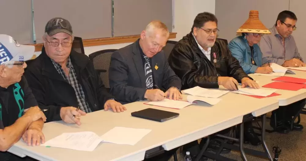 Maa-nulth Treaty First Nations representatives sign 2018 treaty update with former MLA Scott Fraser, minister of Indigenous Relations and Reconciliation at the time. (HFN photo)