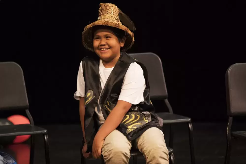  Alexander Ambrose smiles while being acknowledged onstage during the Nuu-chah-nulth Tribal Council Scholarship Ceremony held at the Alberni District Secondary School in Port Alberni, on June 10, 2022.