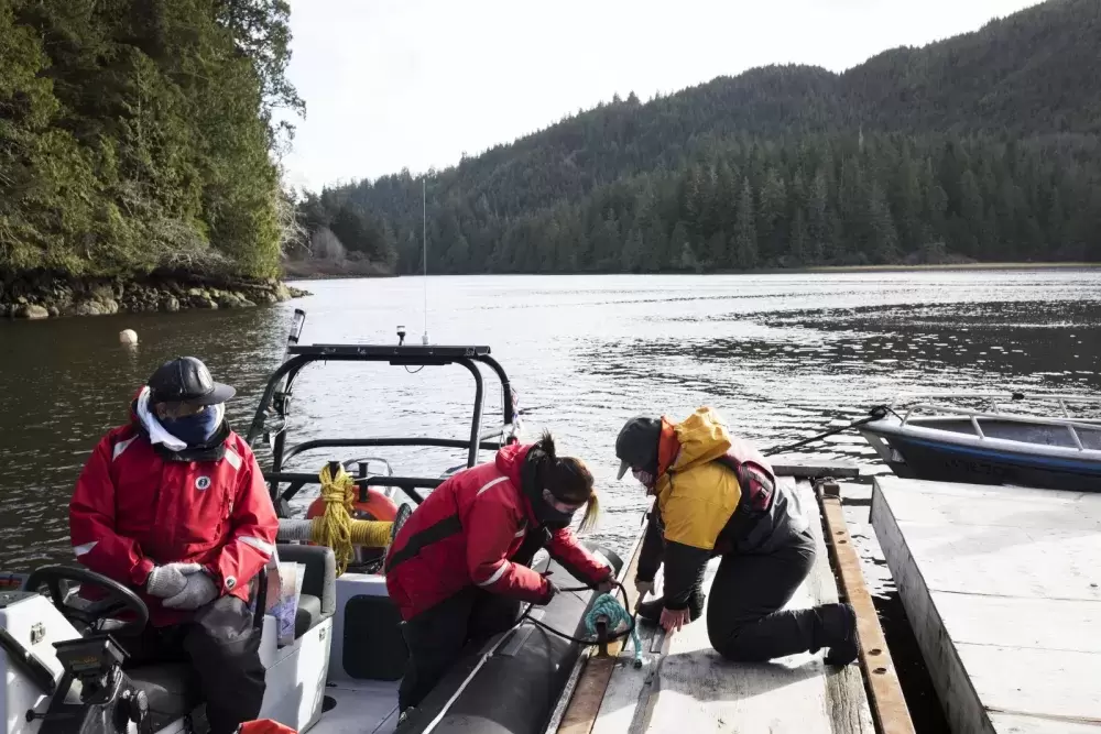 Datum Marine instructor, Marla Barker (right), helps Brianna Lambert tie a secure knot after docking the boat during the Captain's Boat Camp, near Tofino, on Feb. 22 2021. Photograph by Melissa Renwick