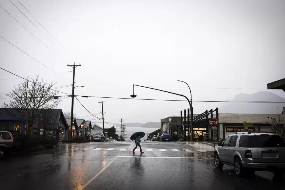 A pedestrian walks through the intersection at First Street in Tofino, on Nov. 16, 2020.